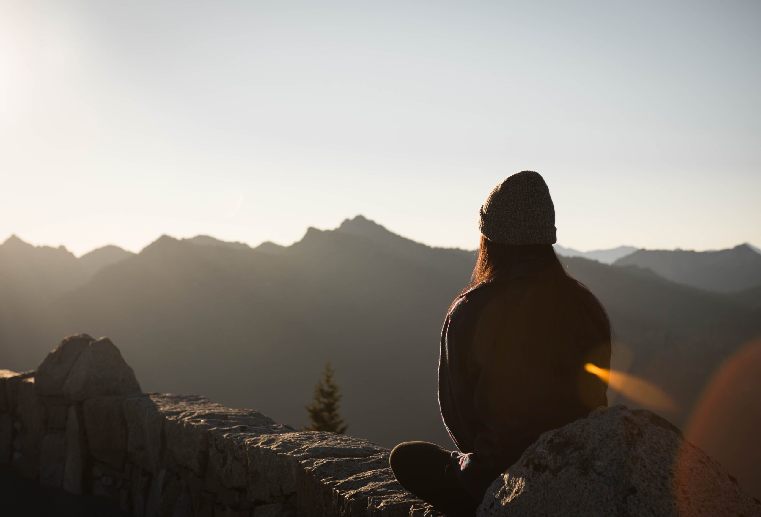 woman meditating on a mountain